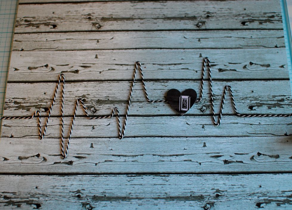 Attach the heart onto the right side of the straight twine area, as pictured.