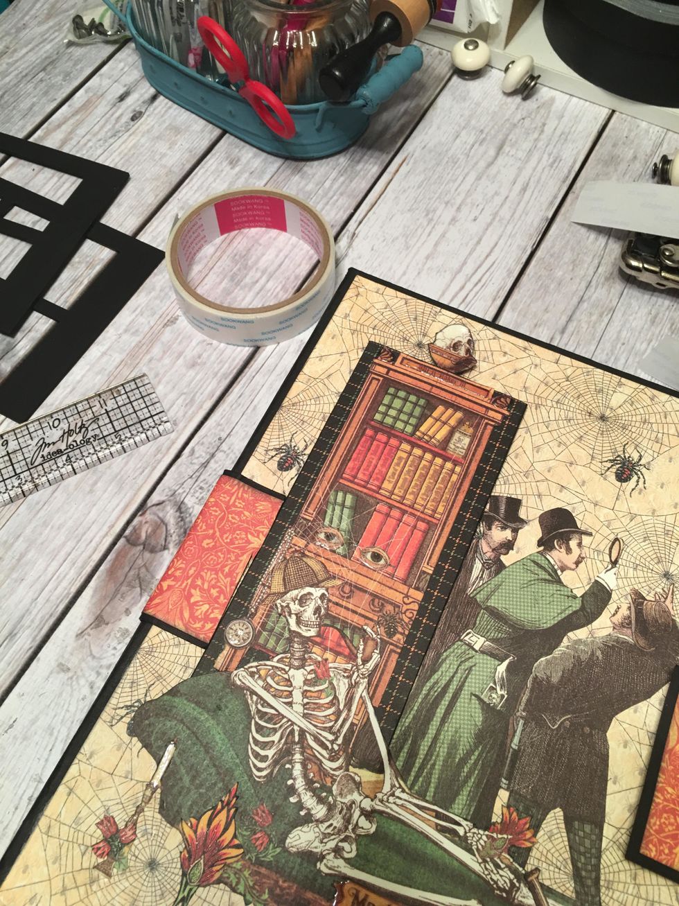 Attach the left side of the closure piece to the left side of the album wrapped to the front and positioned up to the cabinet as shown.