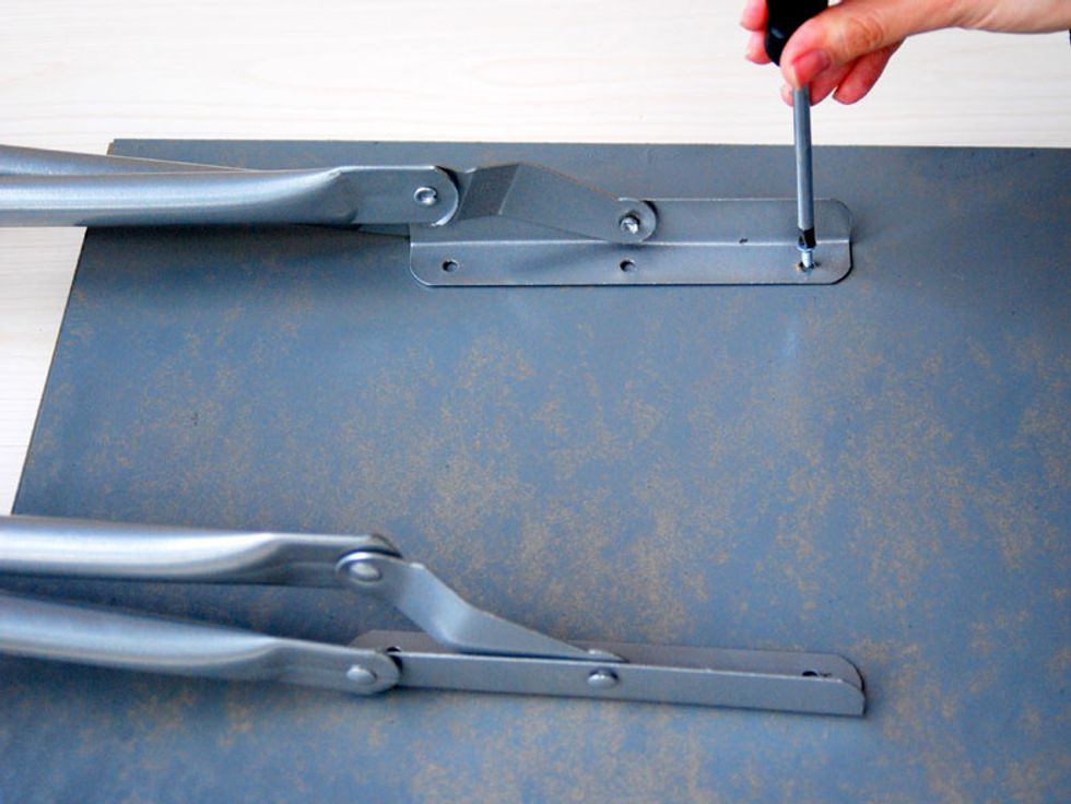 Attach the legs of the stool to the bottom of the tray. If wood tray too thin, you can attach the legs with epoxy glue or metal adhesive.