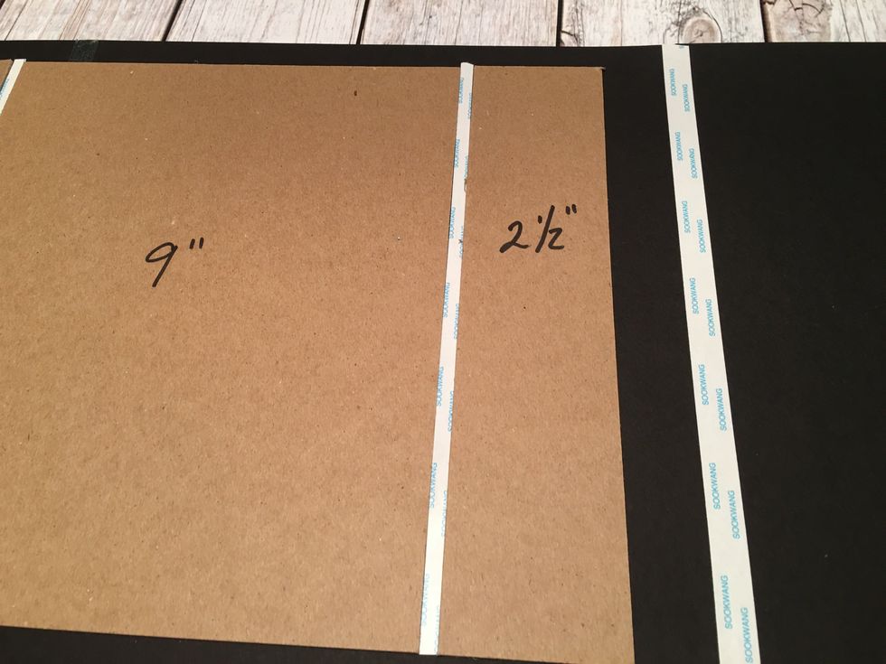 Attach the one 2 1/2" chipboard pieces along the spacer tape as shown.