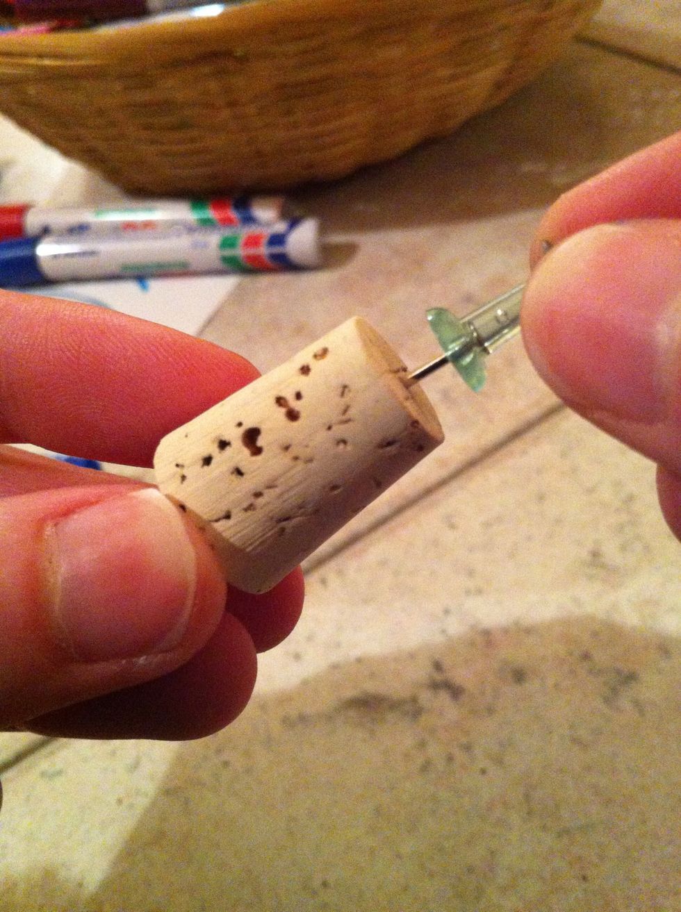 attach the plastic thumbtack to the cork!(: