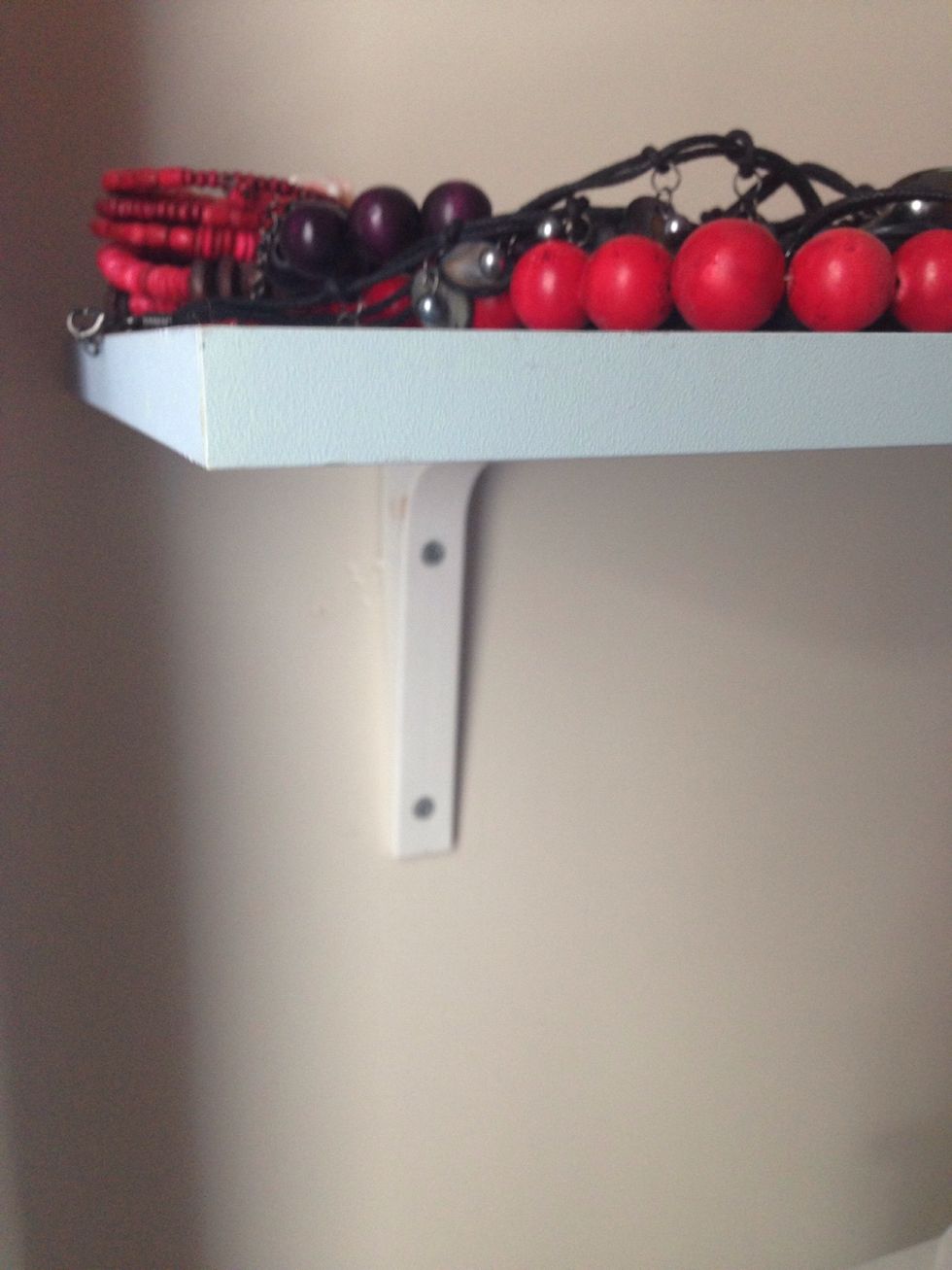 attach the shelf on the wall appropriately.