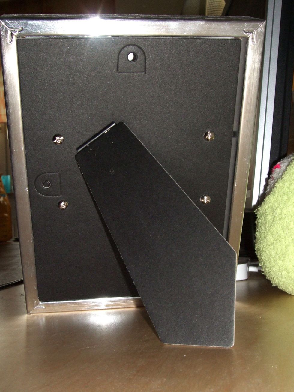 Attach the stand to the back of the harddrive using double-sided tape or - like I did - screws that are supposed for mounting the harddrive in your computer.