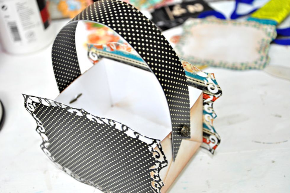 Attach the strip/handle using a couple of brads