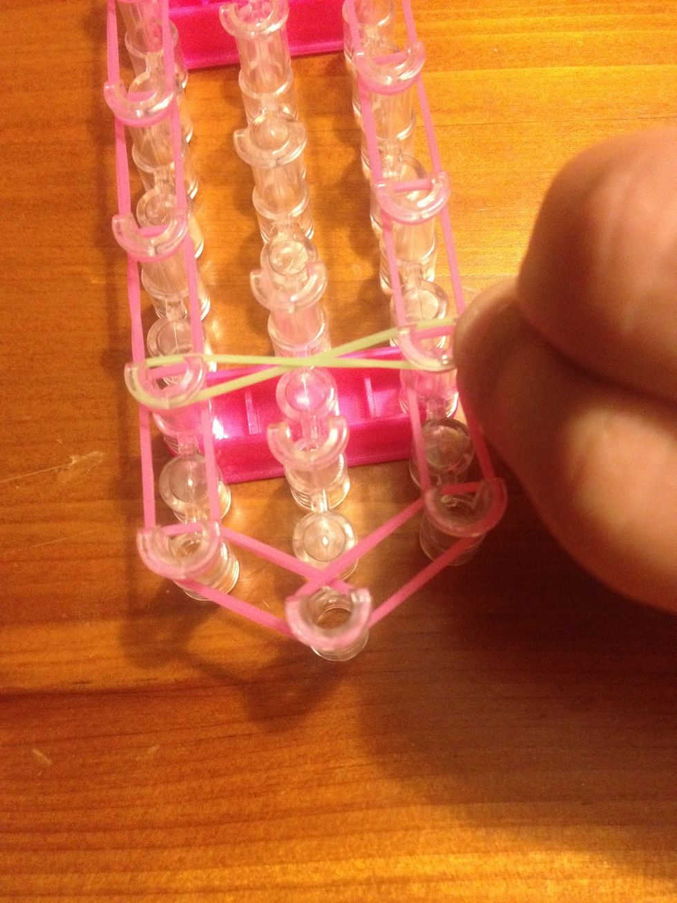 Attach to second right hand side pin. It should resemble a figure 8 or and infinity sign