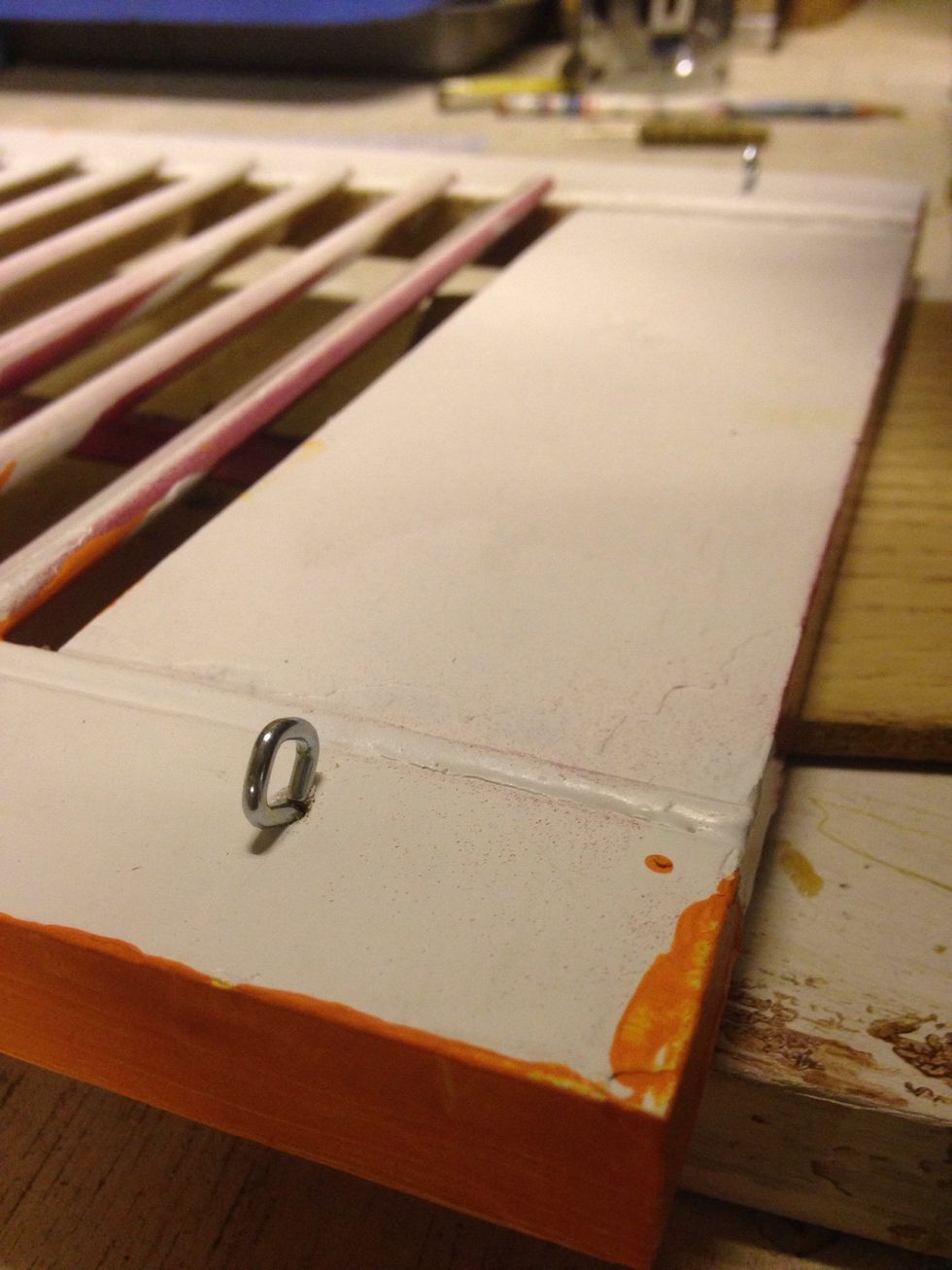 Attach two eyehooks to the back of the shutter at the top on each side.