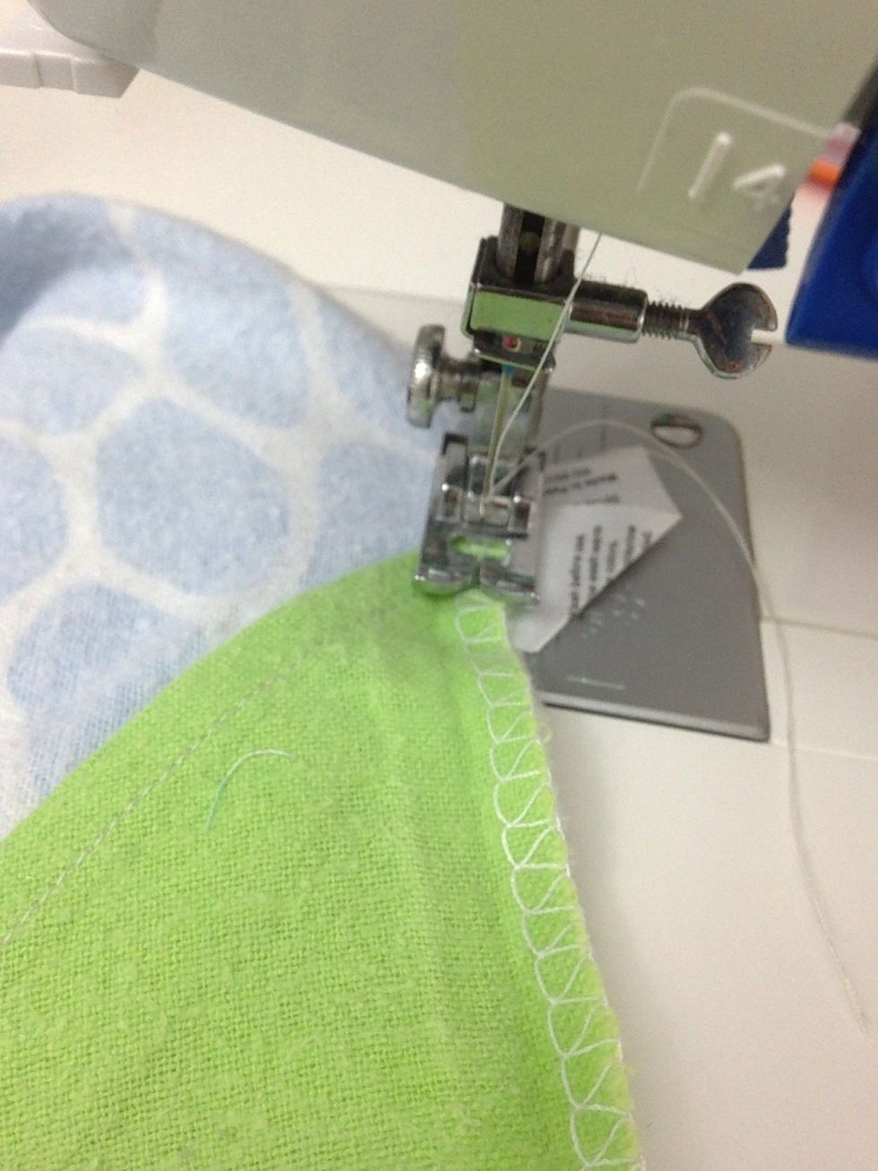 Attach velcro lines together again and stitch sides of blankets together. I used a zigzag stitch, but if you've got a serger, this is the place to use it.