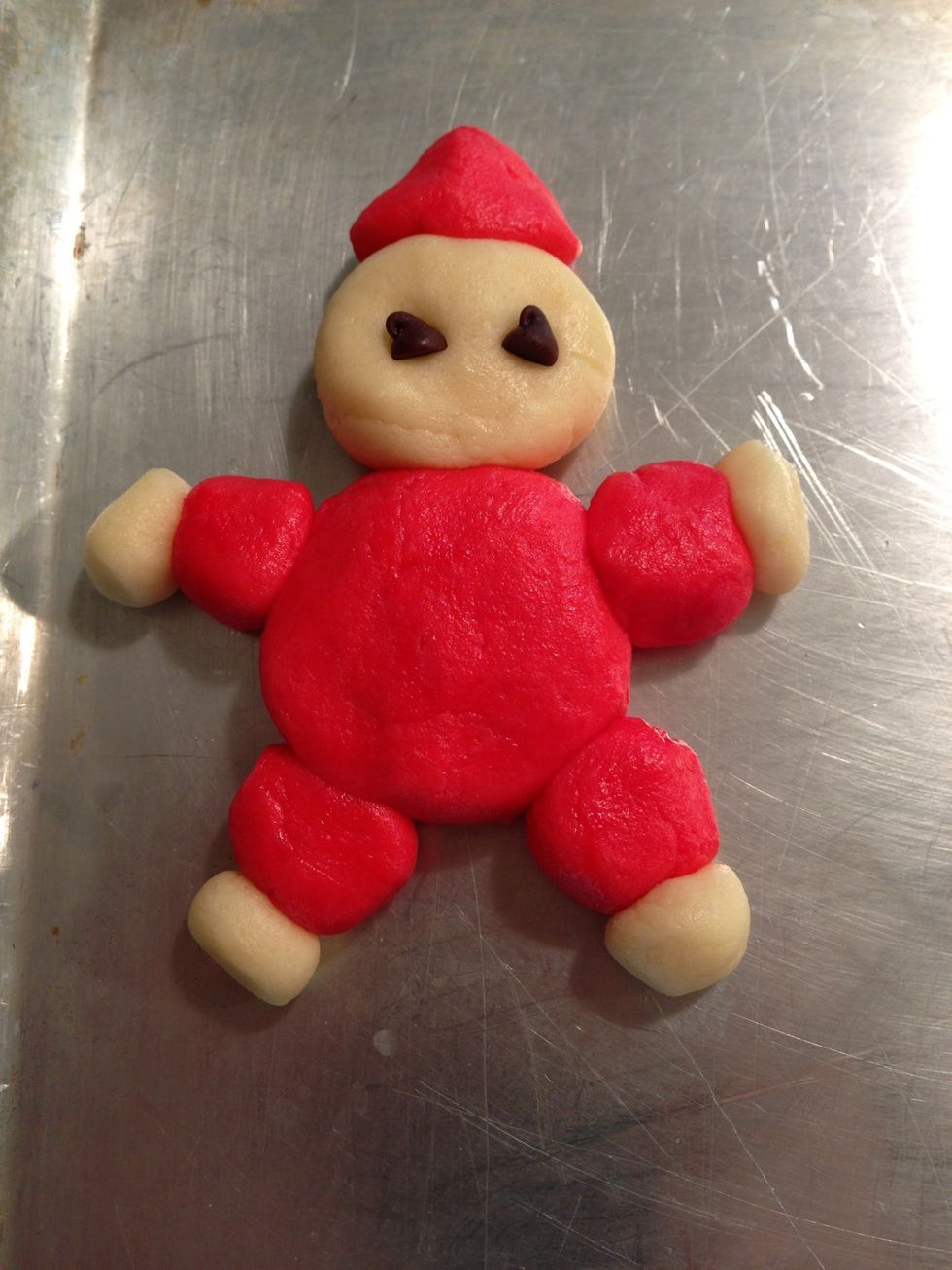 Attach white 1/4" balls to arms and legs and place chips in for eyes. Note: 3 chips can be added as buttons down front of suit. Some years I do those... Some years I forget, like this year!