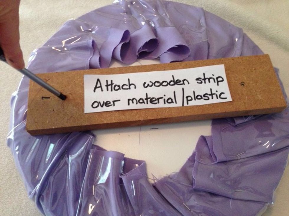 Attach wood with screws. (I marked the wood strip & on the seat before so that it is centered)