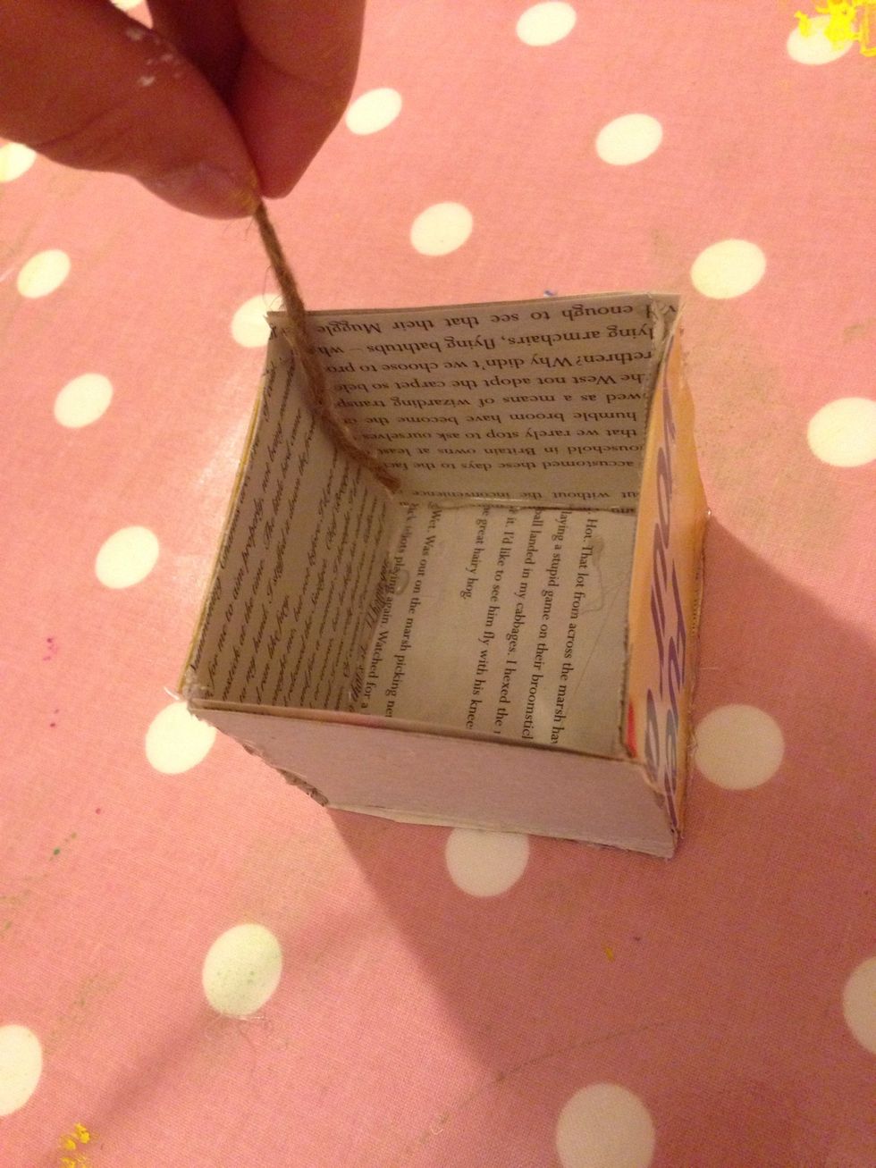 Attach yarn to the corners and bottom of the box