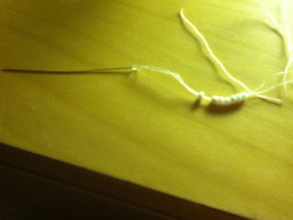 Attach your choice of beads, remember put one less than the amount of threads!