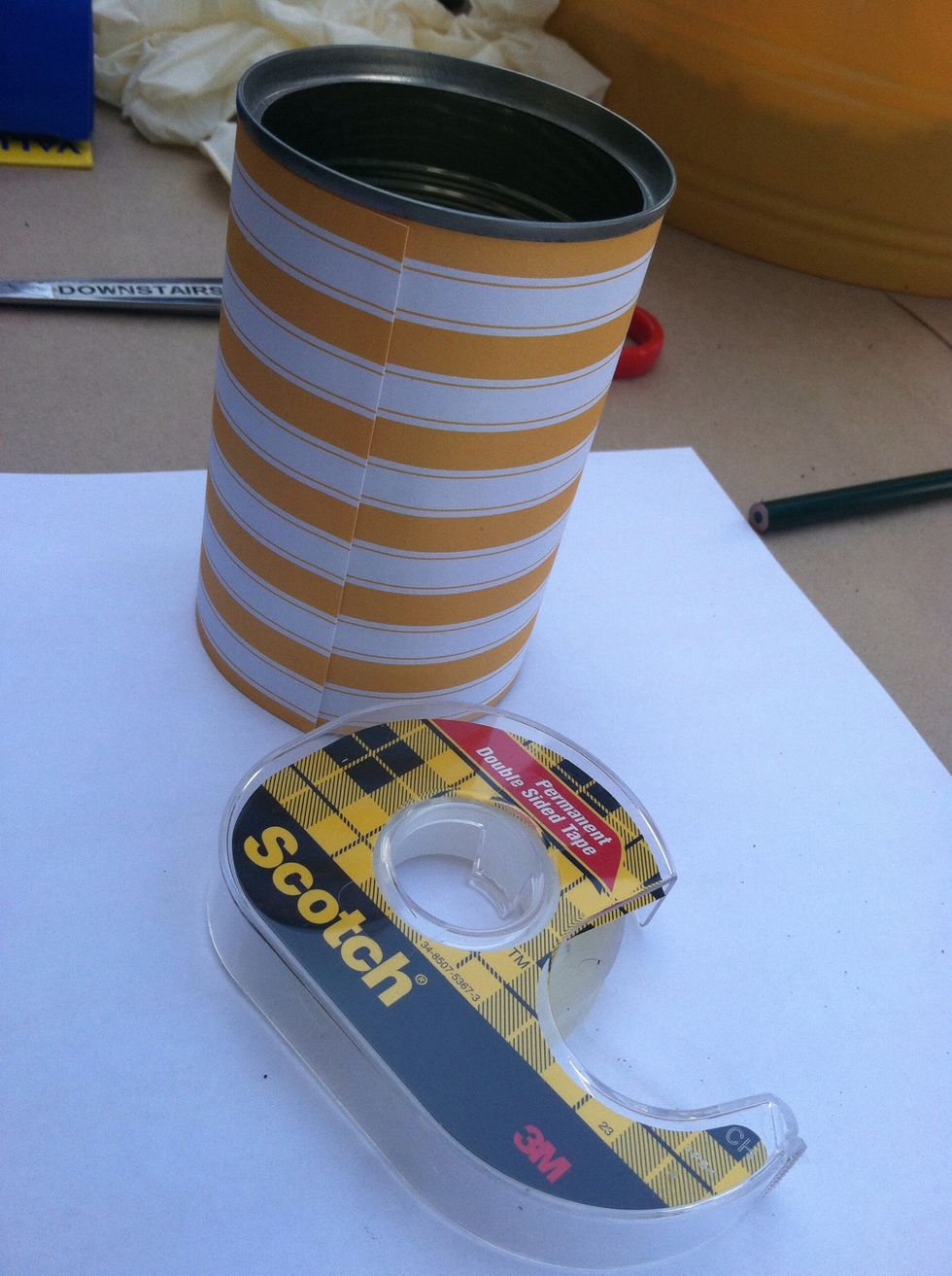 Attach your craft paper to the tin can using double sided tape.