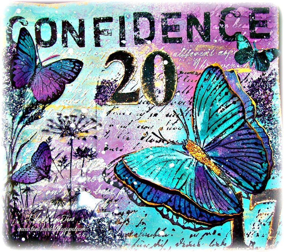Attach your smaller butterflies and splatter water-downed white gesso over the top of your page for more interest.