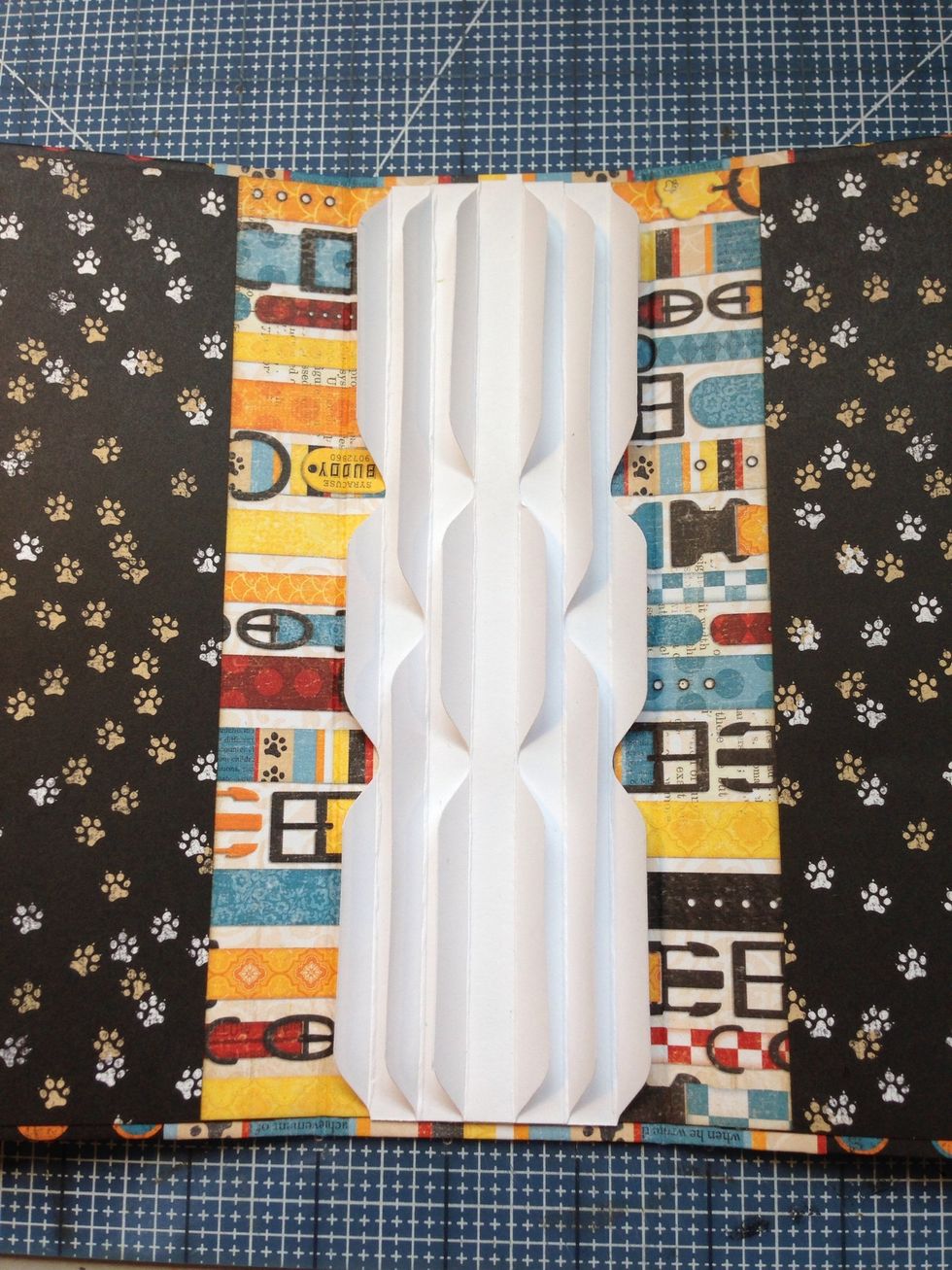 Attach your Stack the Deck binding unit to the center of the the spine.