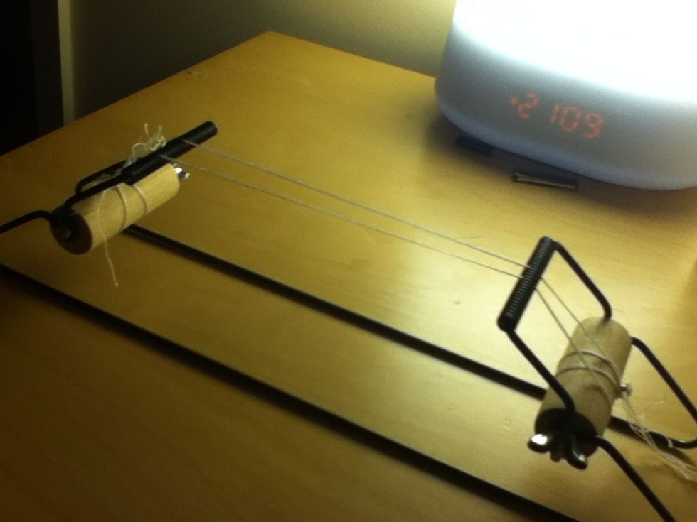 Attach your thread then spread the threads out on the loom with a space in the middle.