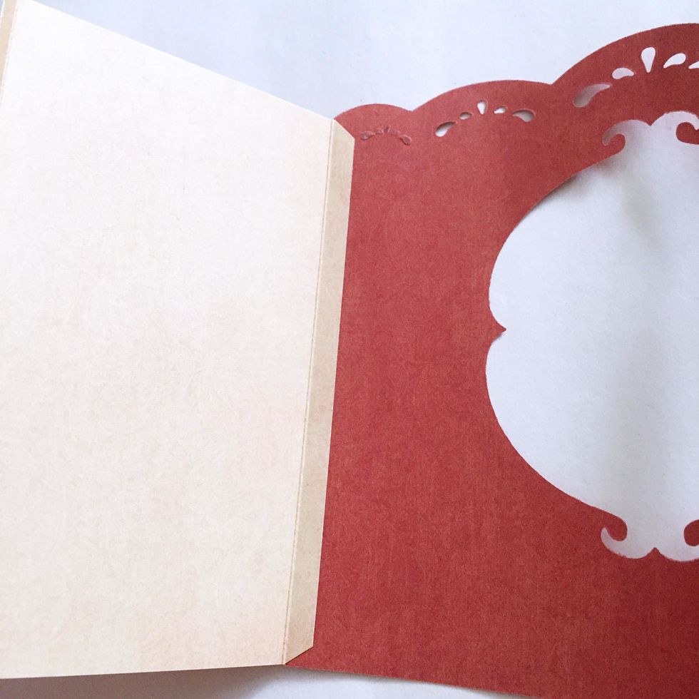 Attached and glue onto the interior of the cover as shown.