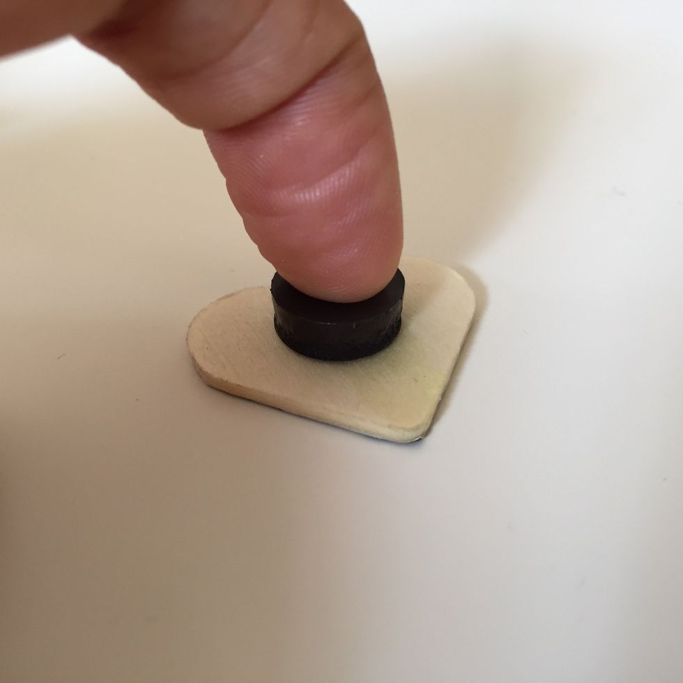 Attaching Magnet a. Apply small amount of hot glue on center of undecorated side of wooden heart. b. Carefully place magnet round and press down until secure.