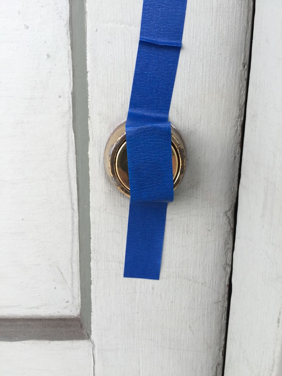 August includes a piece of blue painter tape that you can use to temporarily tape over the front of your lock. This will keep it in place while you replace your indoor knob with the August Smart Lock.