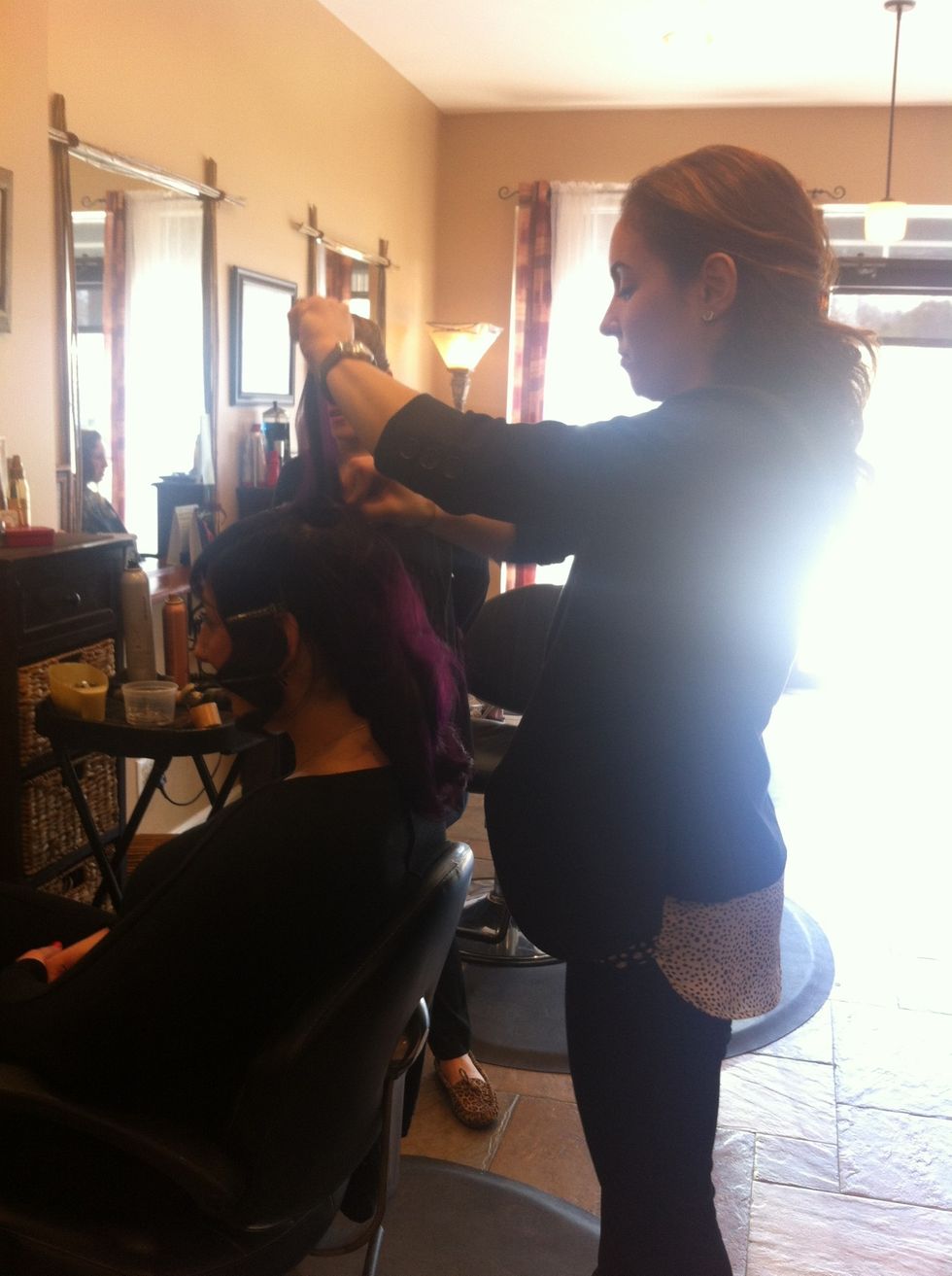 Back comb hair in the crown area to give lift ..