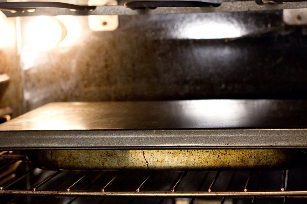 Back in the oven(225F). I didn't have tin foil so I used a baking sheet to cover the pan.