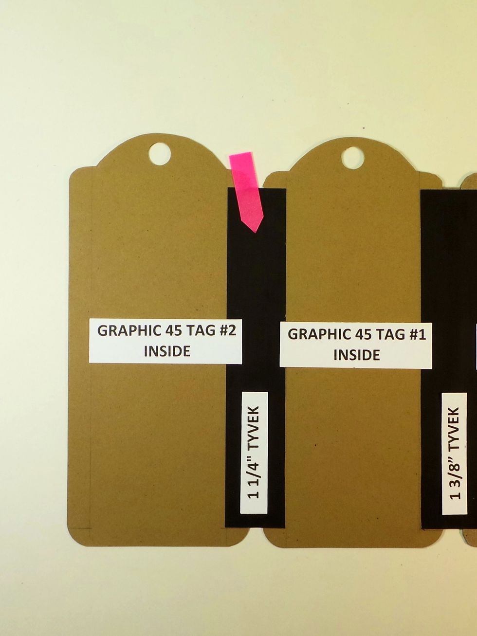 Back on the inside now. The red arrow shows the black Tyvek we just finished adding, and the new paper tag is on the left. Give the Tyvek a good burnish.
