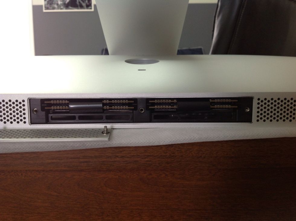 Back out the screws and remover cover. This will expose your memory cards/slots.