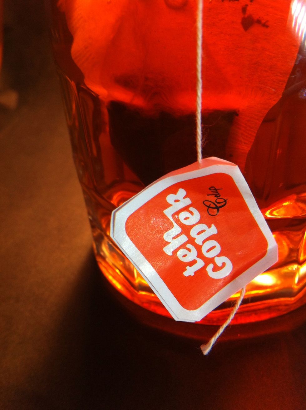 Back side lighting to create lighting for tea color for more better and front side to make a focusing photo to product lebel