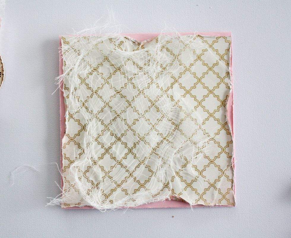 Back to assembling the card. Layer the pattern paper on top of the cardstock. Make sure the cardstock fold is at the top and not the side. This is so the card opens upward as an easel for the canvas.