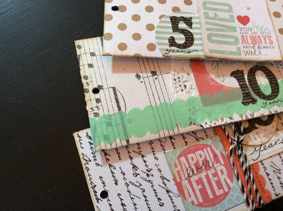 Back to envelope book construction....Punch hole in the bottom of each envelope. (Place envelope inside cover for proper hole placement).