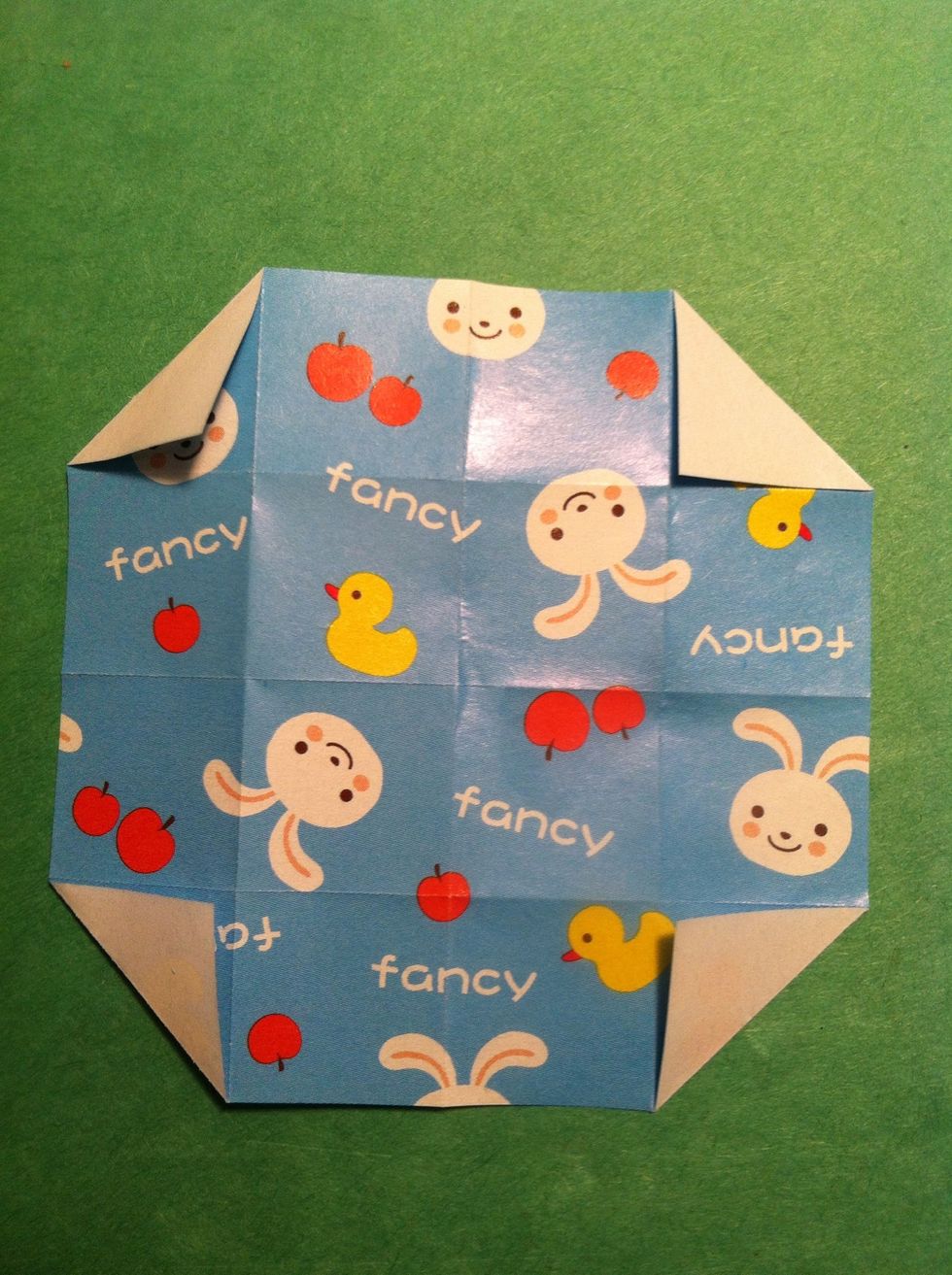 Back to work. Flip it over & fold each corner to center.