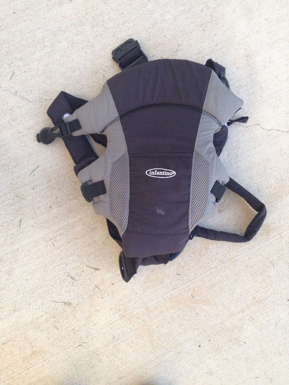 Back view of front pack baby carrier