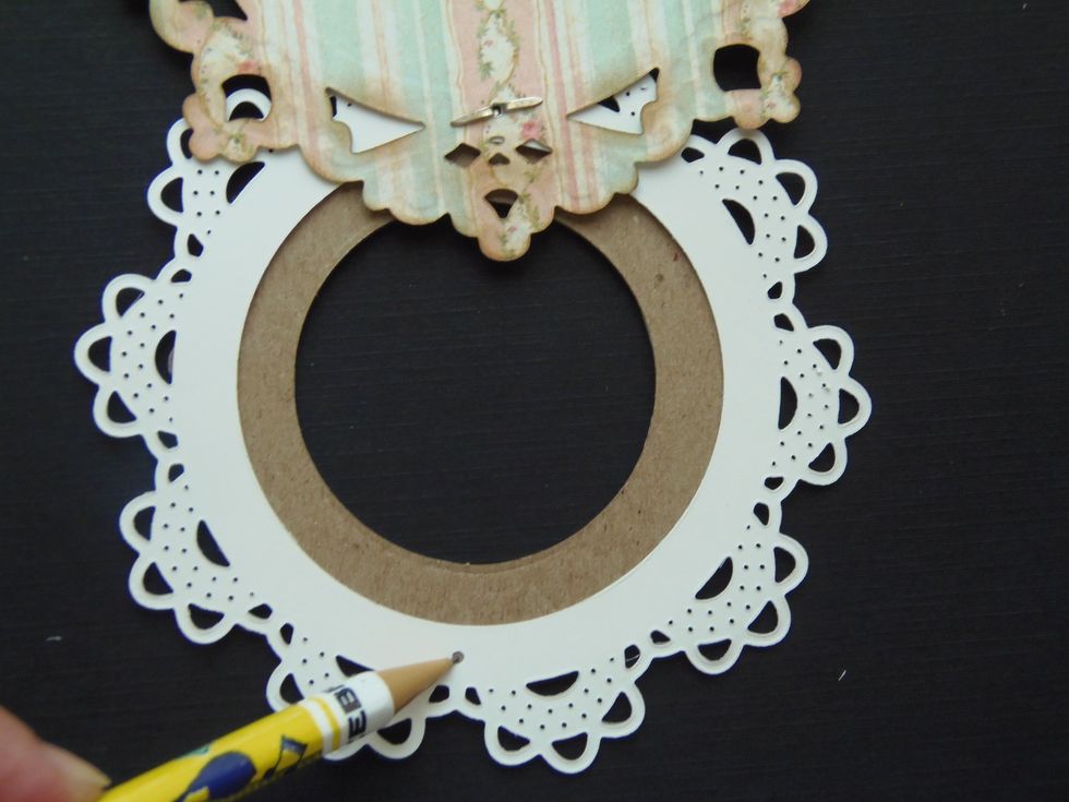 Back view of the card. Use the hole, that was punched on the doily, as a guide to mark where the hole will be punched on the chipboard frame.