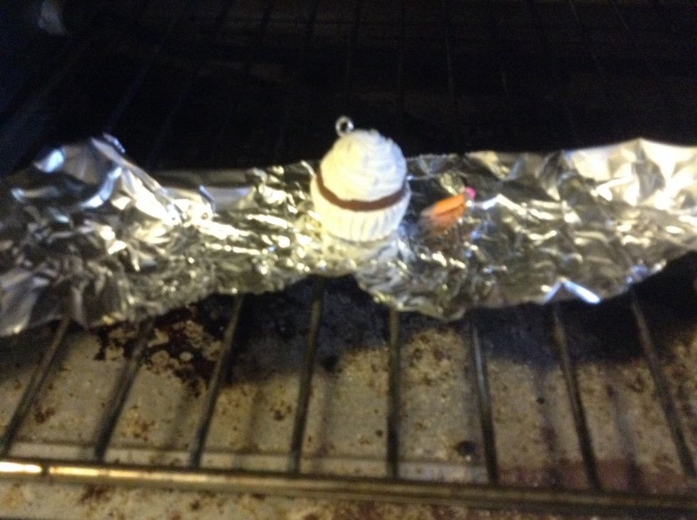 Bake according to package instructions, but if you threw yours away without thinking, try 275 F and check every 5 min.