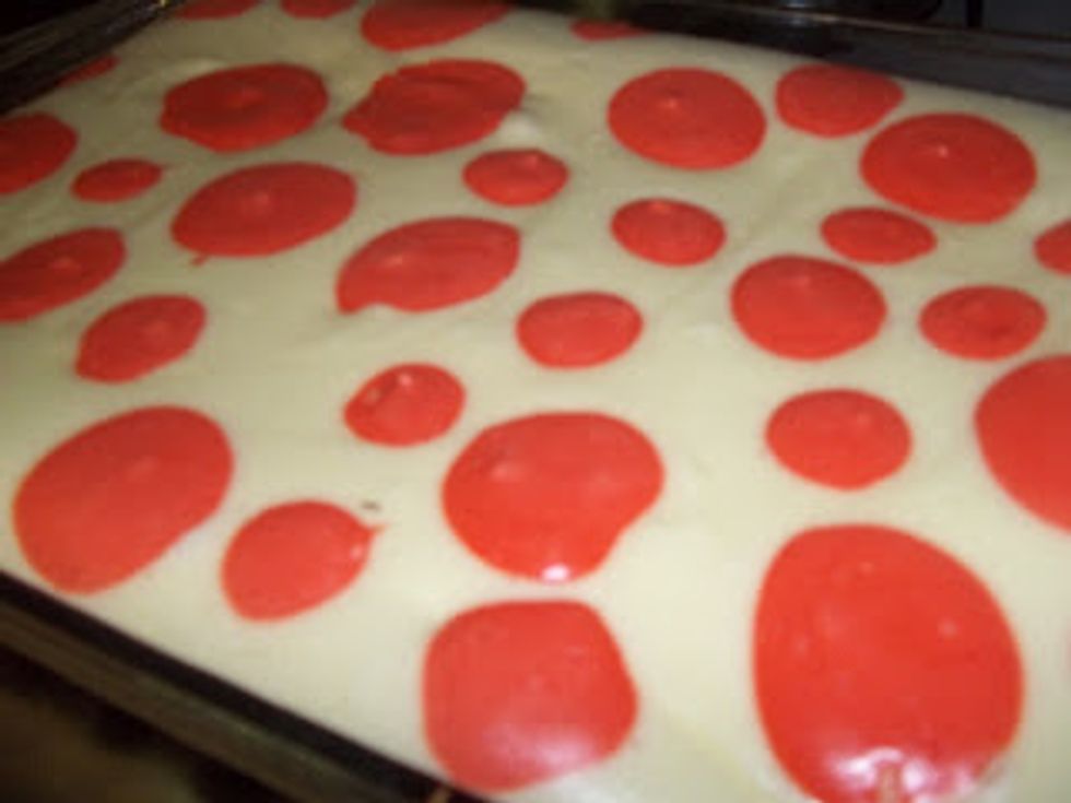 Bake at 325 degree's for 30-40 minutes.  Don't bake it until it is browned, just until the middle isn't wiggly and jiggly anymore!   The "dots" will not spread, they will stay in tact and not run.