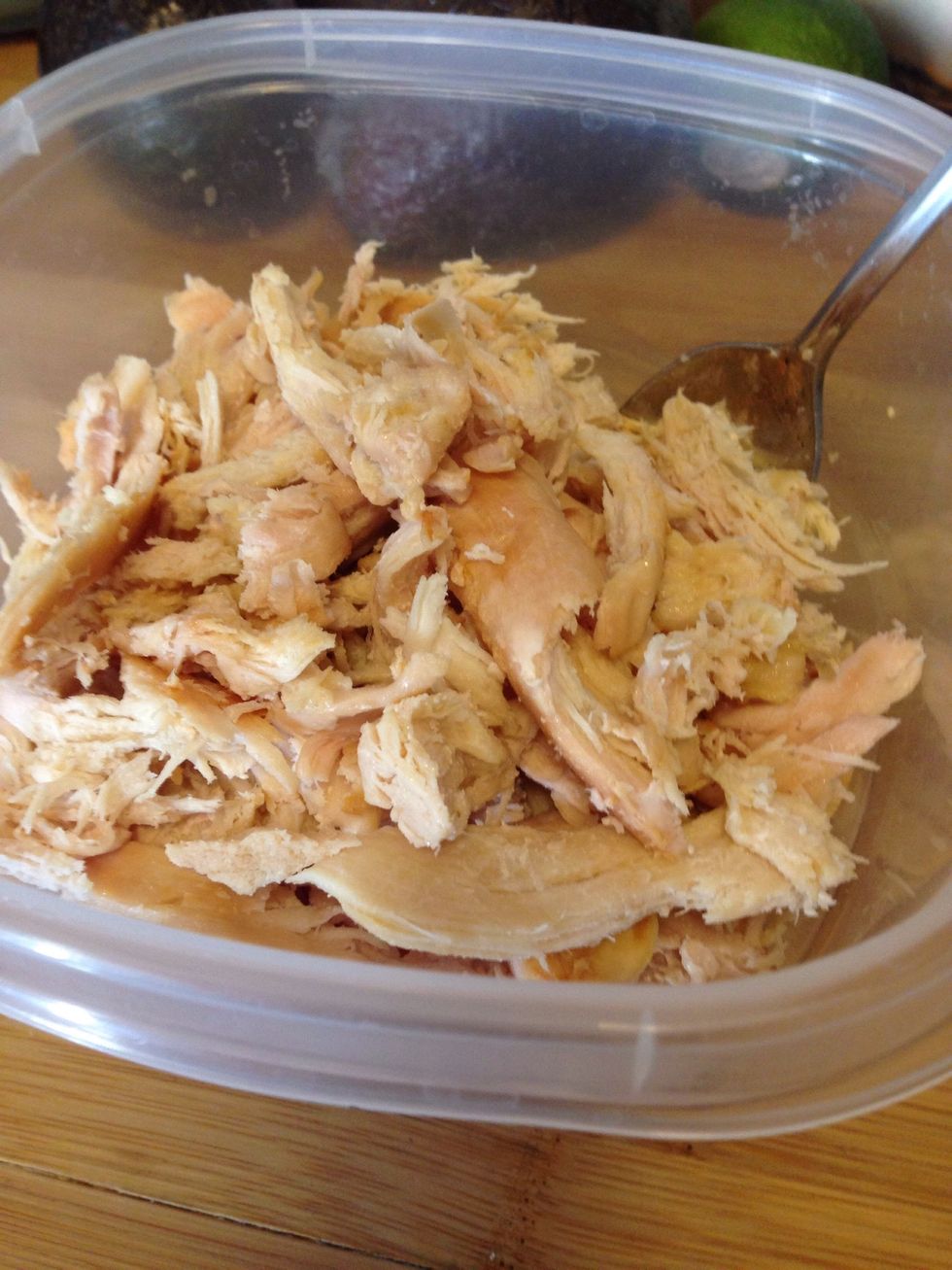 Bake chicken breasts in the oven, let cool, then shred with two forks. Set aside.