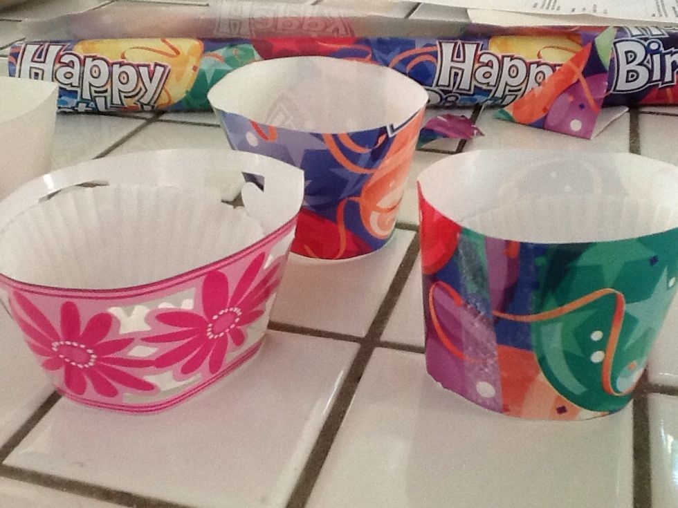 Bake cupcakes in white liners then place in your wrapper. Store bought vs. home made... Get kids involved in making their wrappers after coloring white paper wrappers! Put names on 'em! Have fun!