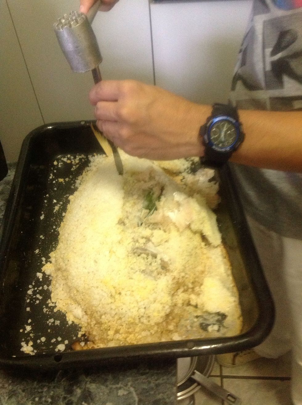 Bake fish in a pre heated oven. I baked this fish on 180 deg/cel for 25 minutes. Remove from oven and crack the crust and lift off the flesh inside.