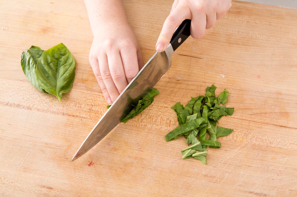 Bake for 8-10 minutes, or until the top has started to brown. While it's baking, chop up some basil as your final topping.