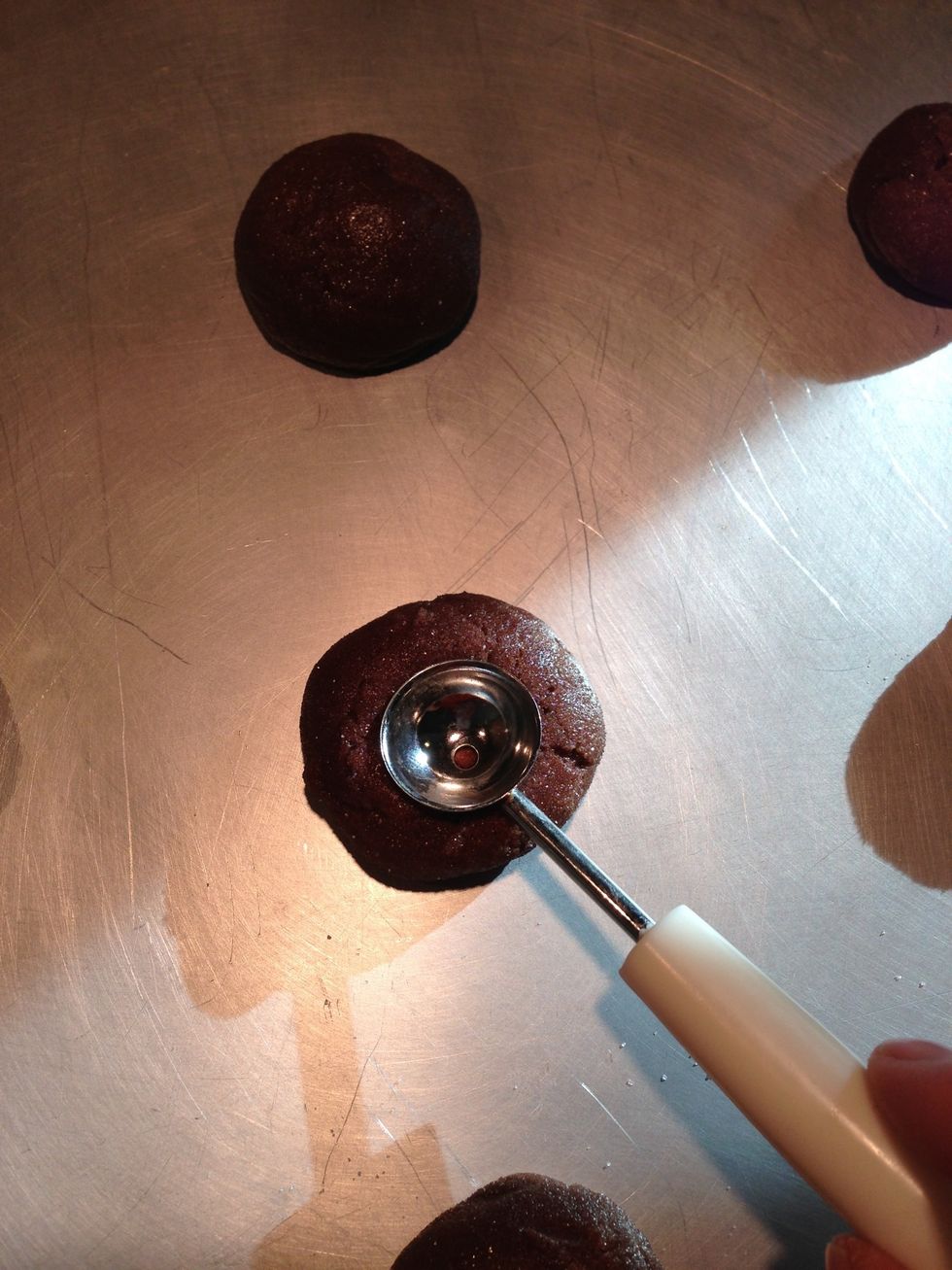 Bake in 350 degree oven for 5 min. After 5 min use melon baller to make an indentation in the center. Bake for 2 more minutes.