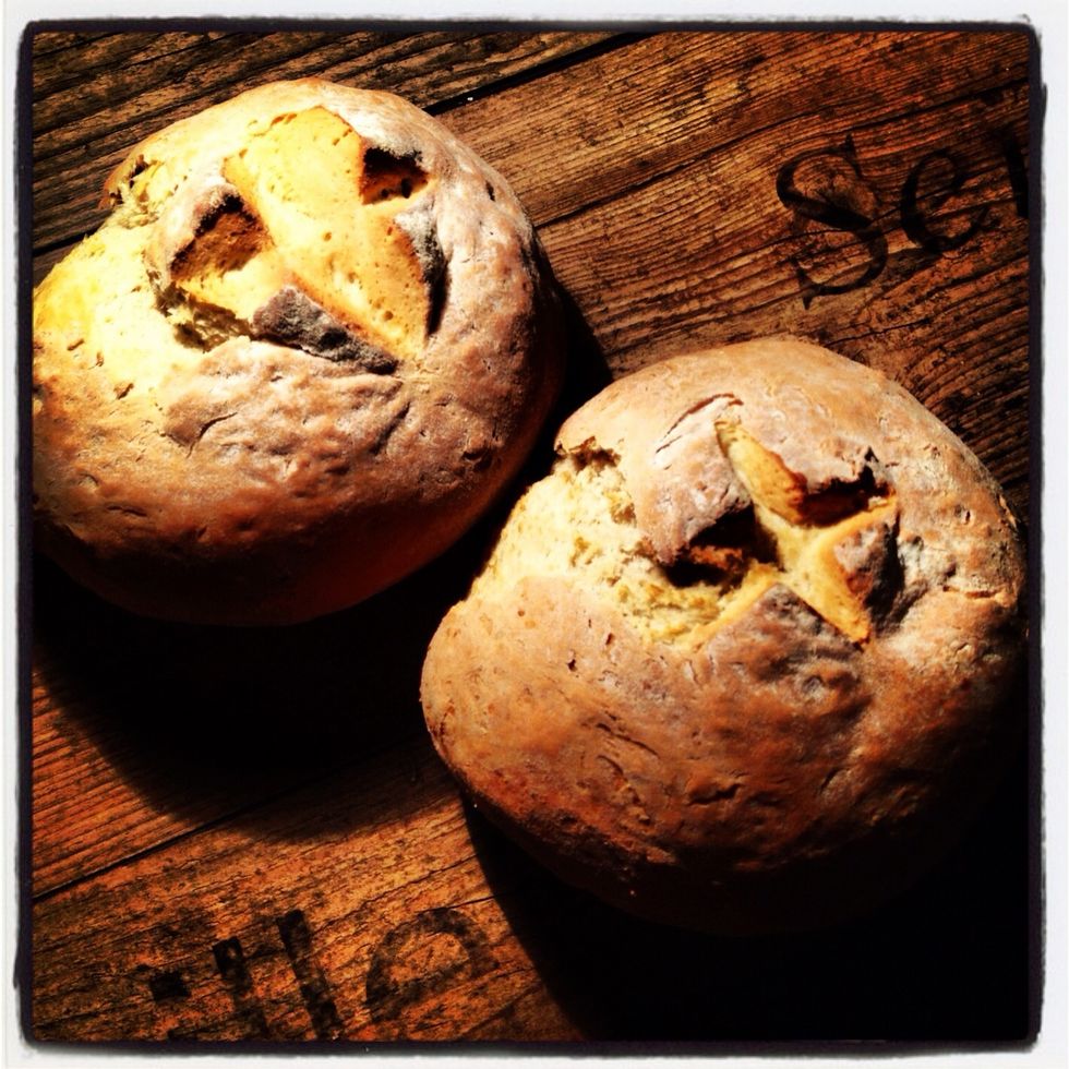 Bake in a pre-heated oven, 400\u00b0F/200\u00b0C/Gas 6 for 40-45 minutes. When baked the underneath when "tapped" should have a hollow sound. Cool on a wire tray. Cover with a tea towel to give a soft crust.