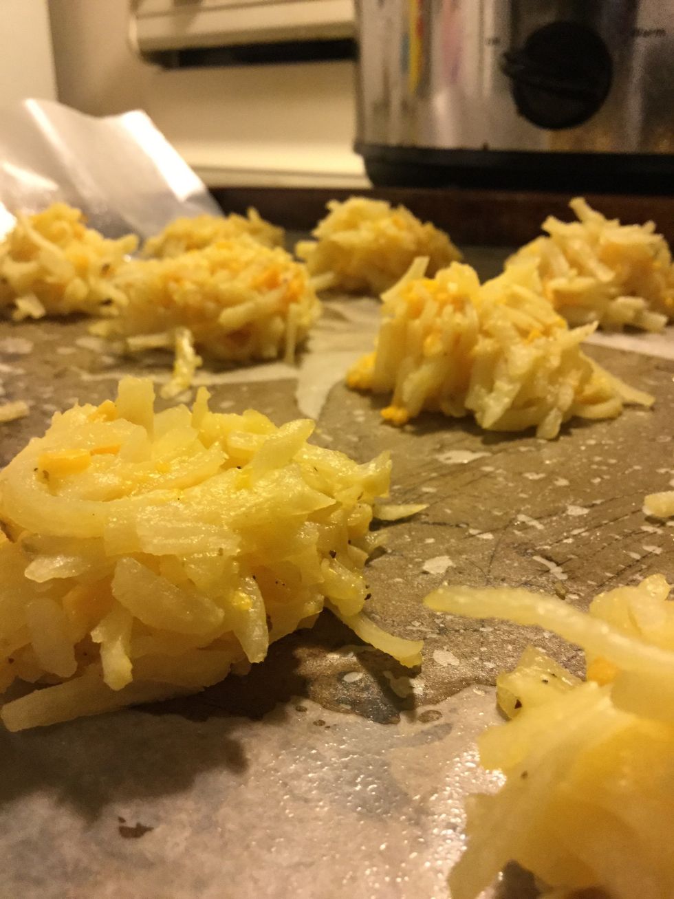 Bake potato cakes at 400 degrees for 20 minutes. Flip cakes over after 10 minutes.