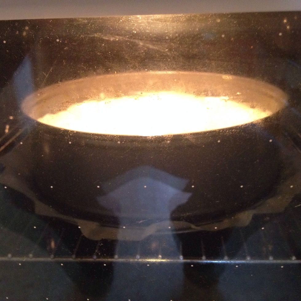 Bake the cheesecake following this scheme: 160 C - 20 min 130 C - 10 min 100 C - 20 min Your cake should now be firm on the edges, but still wobbly in the middle.  Let cool down in the still warm oven