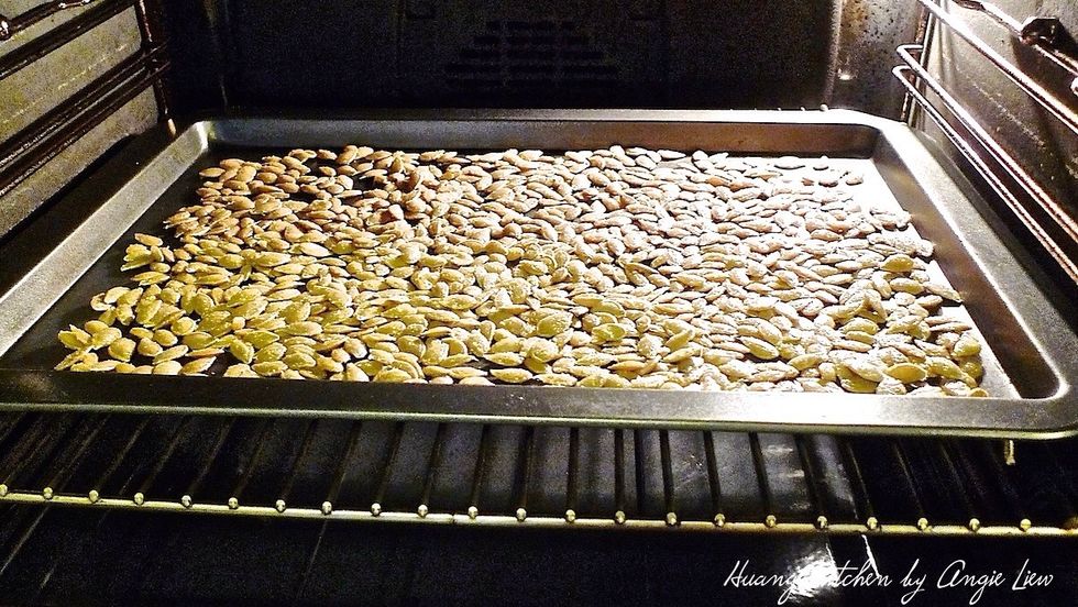 Bake the pumpkin seeds in the preheated oven for 50 - 55 minutes, stirring occasionally.