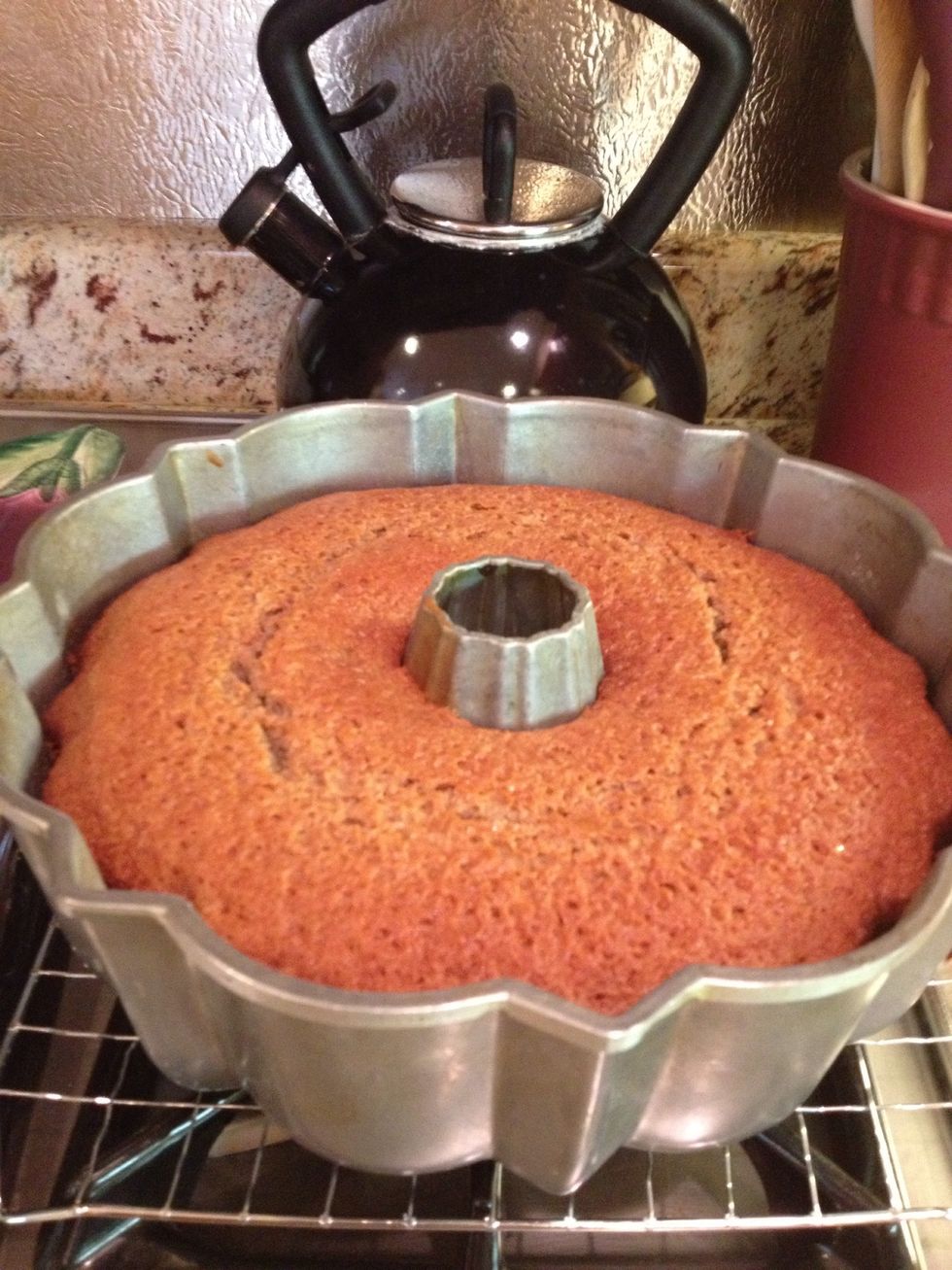 Bake until springy to the touch and a cake tester comes out clean, 45-50 minutes. Transfer pan to a wire rack to cool for 20 minutes, then unmold the cake and cool completely.