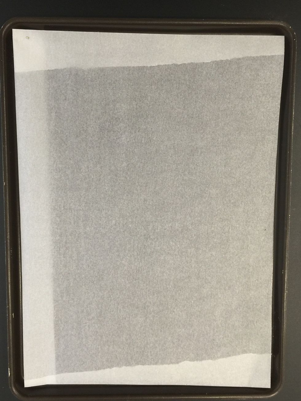 Baking tray lined with parchment paper