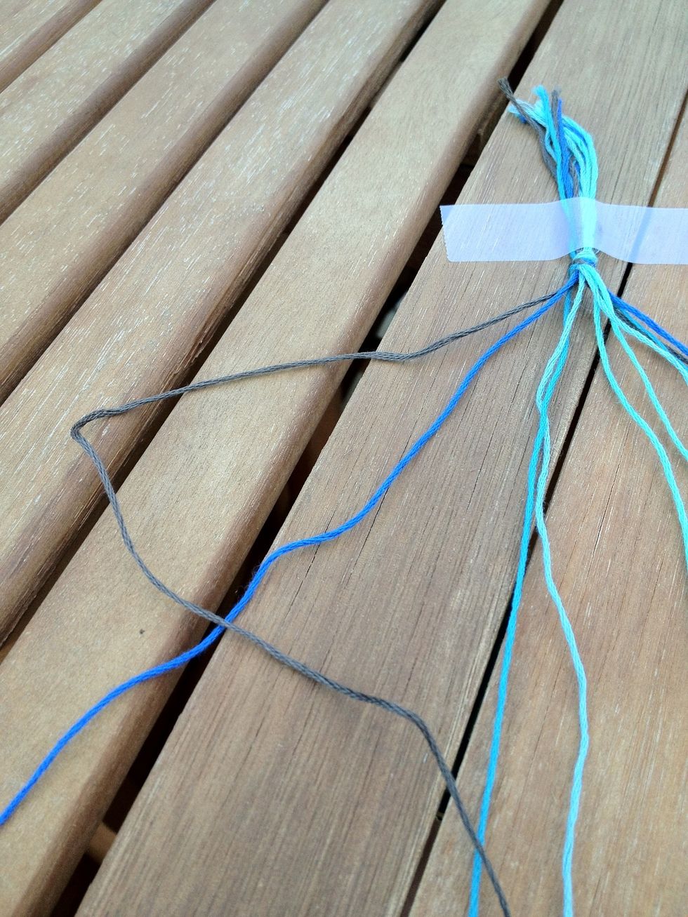 Basically all you're gonna do is make a bunch of knots. Cross the first string on the left side over the second string, like so.