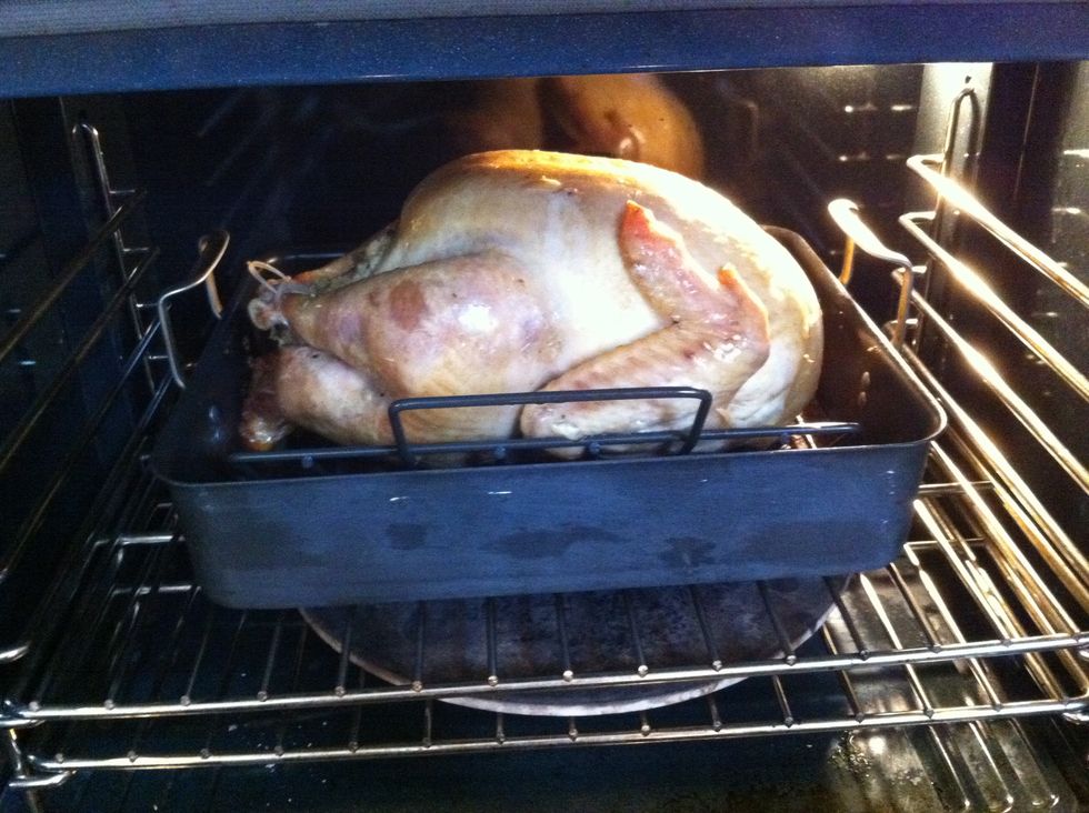 Baste the turkey roughly every hour. You can take off the aluminum foil once the bird has come up to about 140 degrees, or roughly 2/3 of the cooking time. Reserve the foil for resting the bird.