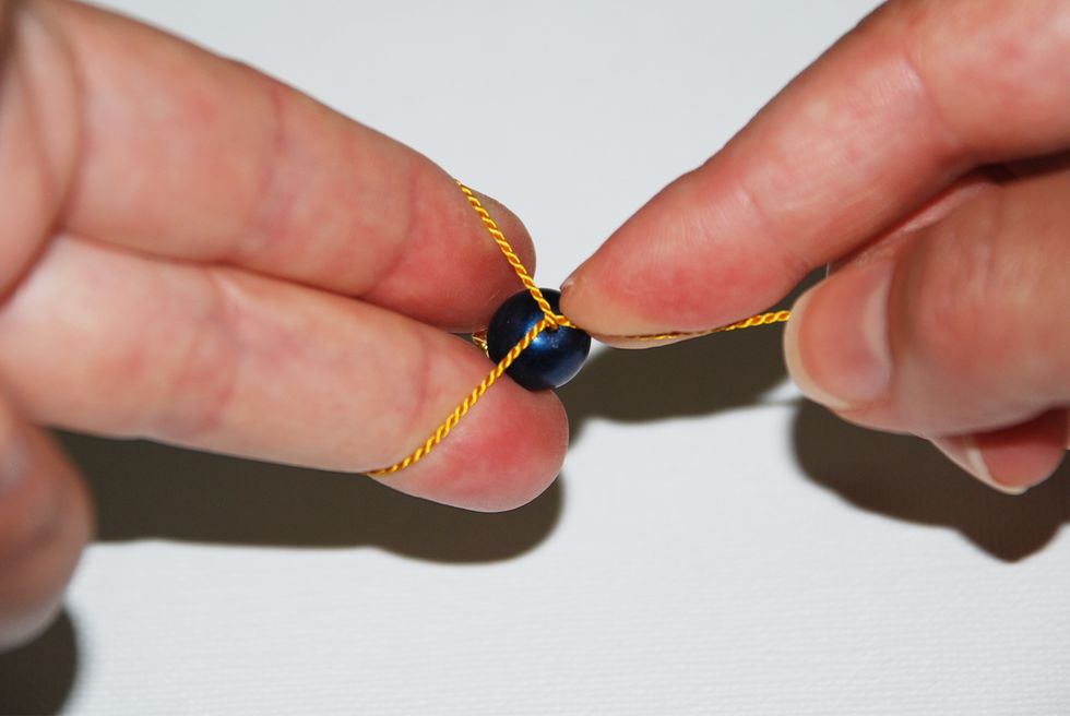 Be careful not to distort the formation - so that you can clearly see the loop as it's coming off your hand.