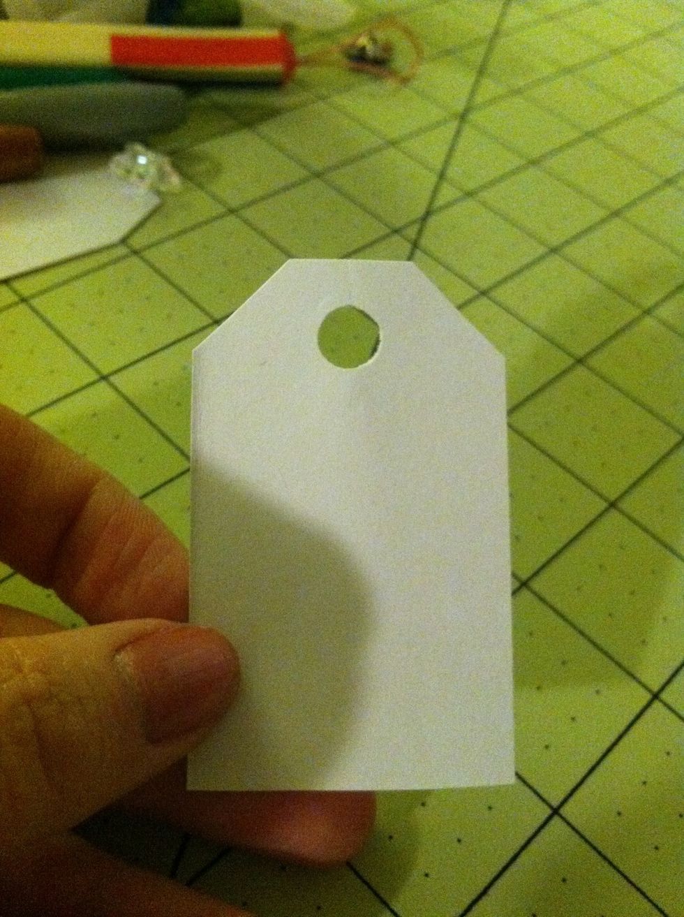 Be careful not to get too close to the edge of your tag when you punch the hole. The paper might rip later when you try to tie it onto your gift.