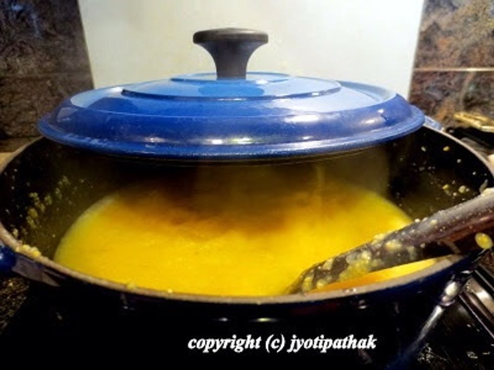 Be careful the mixture pops/spatters and bubble can burn the tender skin.Dhindo is ready when the porridge starts separating 4m the side of the pan.The mixture should be moist, neither runny, nor dry.